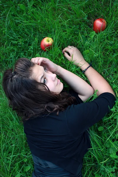 stock image Girl about red apples.