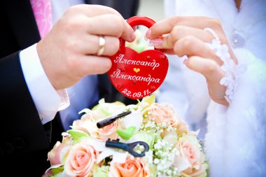 Hands of a newly-married couple clipart