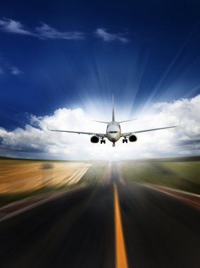 The airplane with the blue sky background. clipart