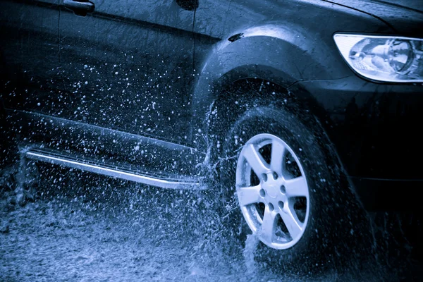 stock image Suv splash on the river outdoor ,traveling on the road.