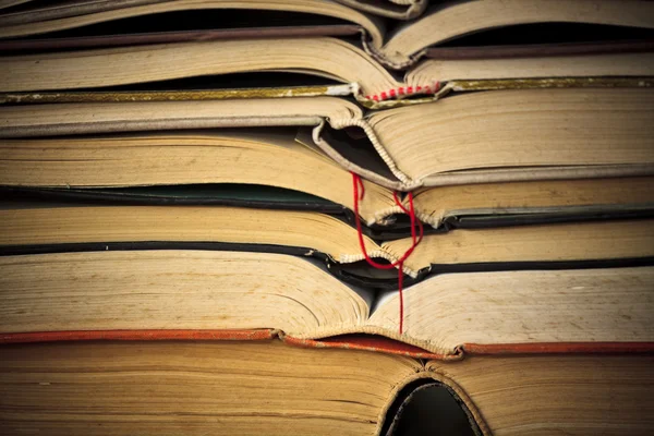 stock image A large stack of old book in home .