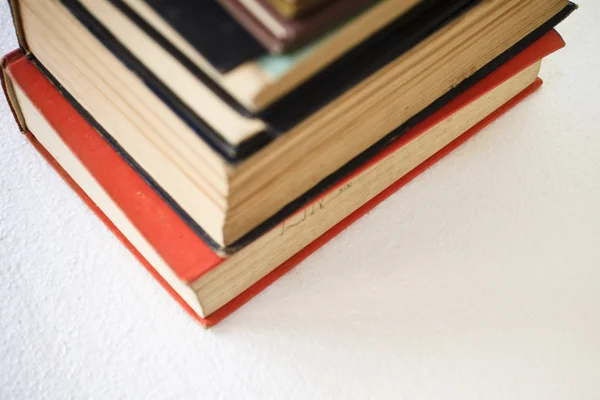 stock image A large stack of old book in home .