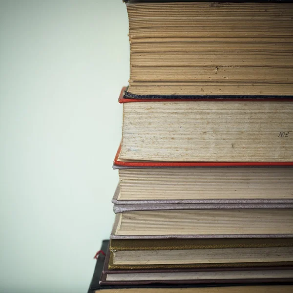 stock image A large stack of old book in home .