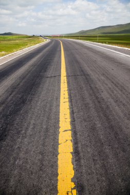 Road to the future with the mountain and blue sky background outdoor.