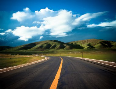 Road to the future with the mountain and blue sky background outdoor. clipart