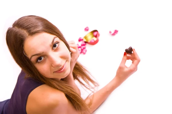 Cute girl with chocolate heart — Stock Photo, Image