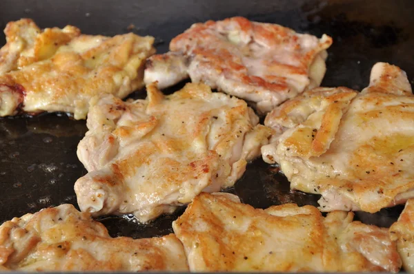 stock image Cooking chicken pieces on grill