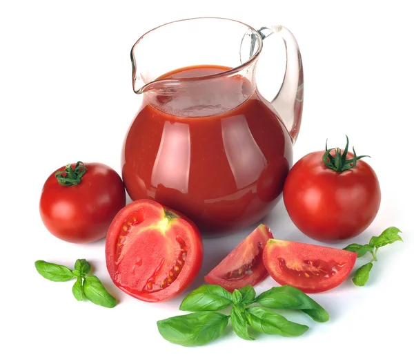 Kruik, glas tomatensap en vruchten — Stockfoto