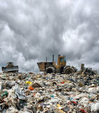 Bulldozer on a garbage dump clipart