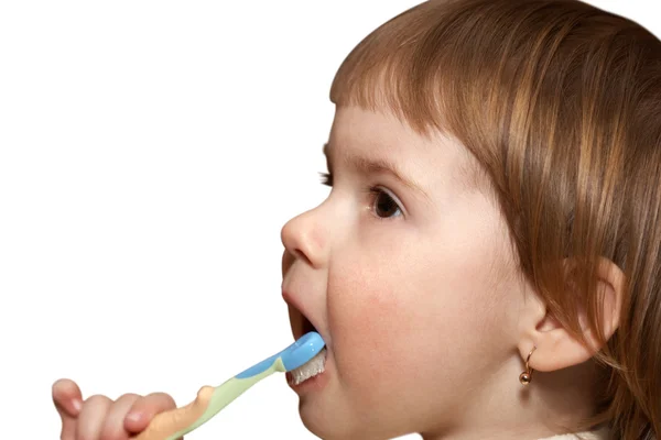 Dítě čistí zuby — Stock fotografie