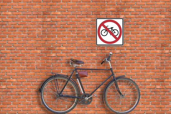 Assina. Parede de tijolo e bicicleta — Fotografia de Stock