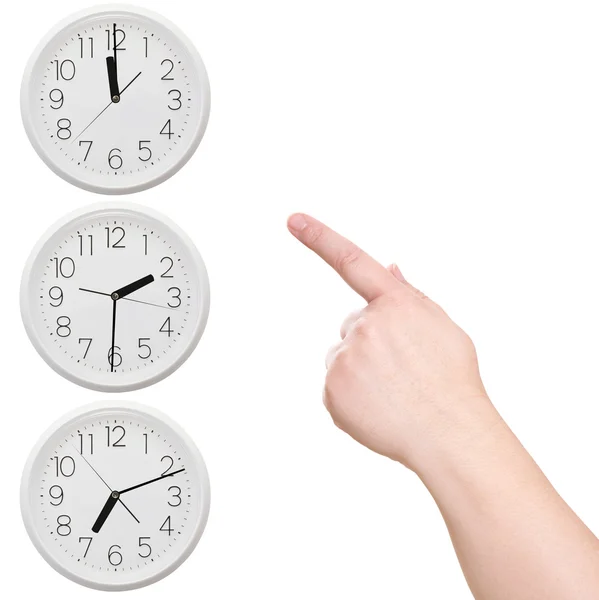 Three clock. Finger points to the clock — Stock Photo, Image
