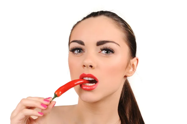 Young woman with chili pepper isolated on white — Stock Photo, Image