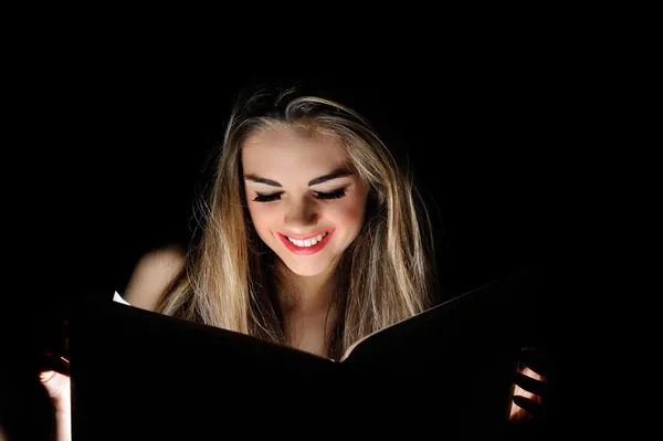 Portrait of young sexy woman reading a magic book — Stock Photo, Image