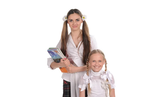 Funny schoolgirls with books in the hand — Stock Photo, Image