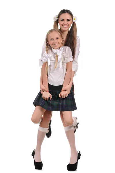 Grappige schoolmeisjes geïsoleerd op witte achtergrond — Stockfoto