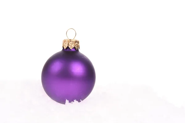 Purple christmas ball with snow on white background — Stock Photo, Image