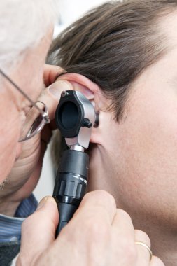 Ear examination clipart