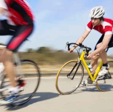 Cyclists in pursuit clipart