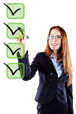 Portrait of a young beautiful business woman checking on checklist boxes clipart