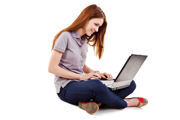 Portrait of a beautiful woman using a laptop - casual still life — Stock Photo, Image