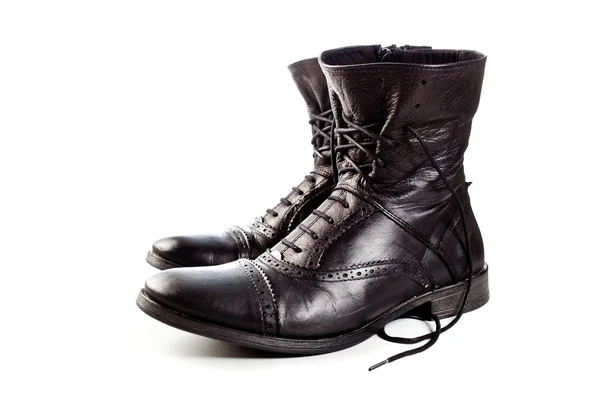 stock image Black leather boots on ahite background