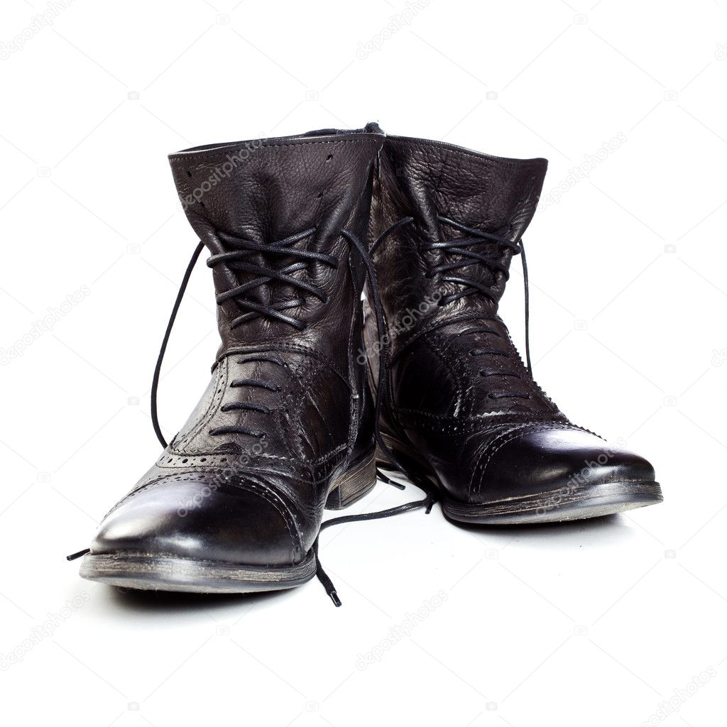Black leather boots on ahite background
