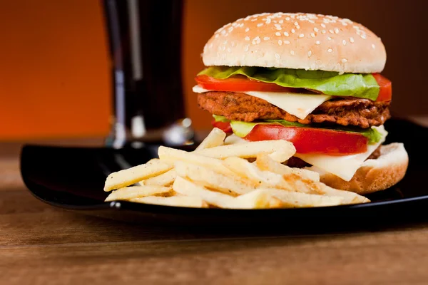 stock image Fast food tasty hamburger with franch fries and soda