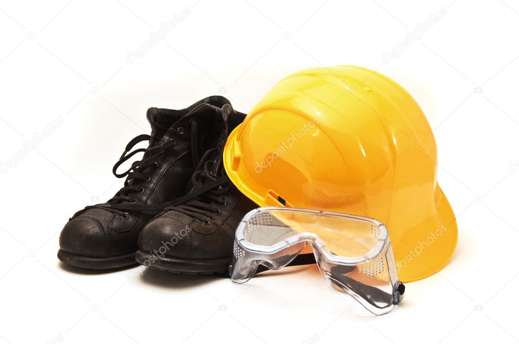 Yellow hard hat, old leather boots and protective goggles