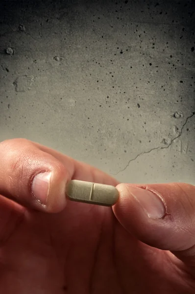 Hand with a pill — Stock Photo, Image