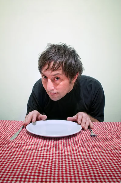 Man and empty plate — Stock Photo, Image