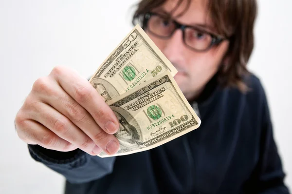 Άνθρωπος πληρώνει σε δολάρια — Φωτογραφία Αρχείου