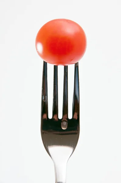 Cherry tomato on a fork — Stock Photo, Image
