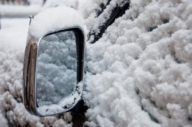 Car wing mirror in snow clipart