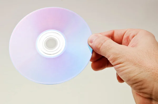Hand met een dvd-schijf — Stockfoto