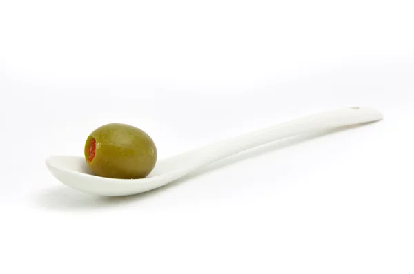 Olive on a spoon — Stock Photo, Image