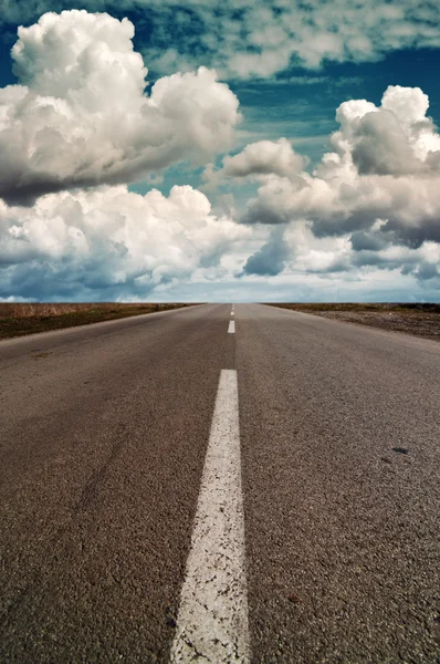 Clouds above a highway — Stock Photo, Image
