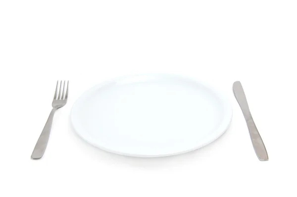 Тарелка с вилкой и ножом — стоковое фото