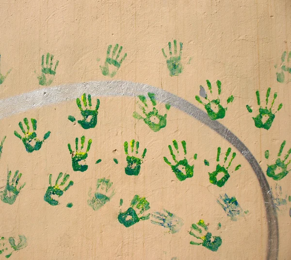 Green handprints on the wall — Stock Photo, Image