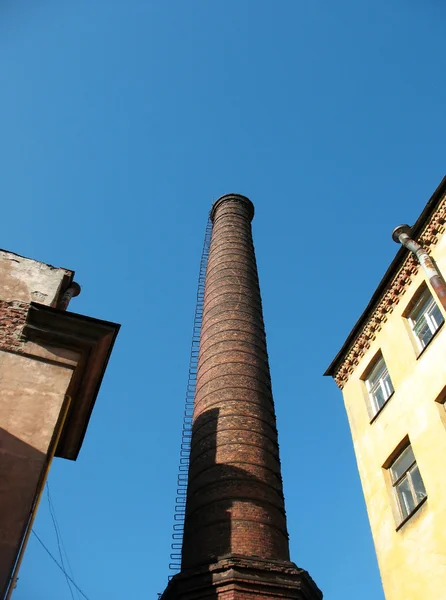Brick chimney in the yard — Stock Photo, Image