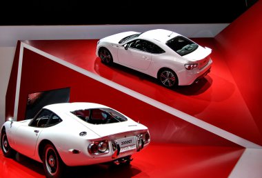 Two white toyota 2000GT clipart