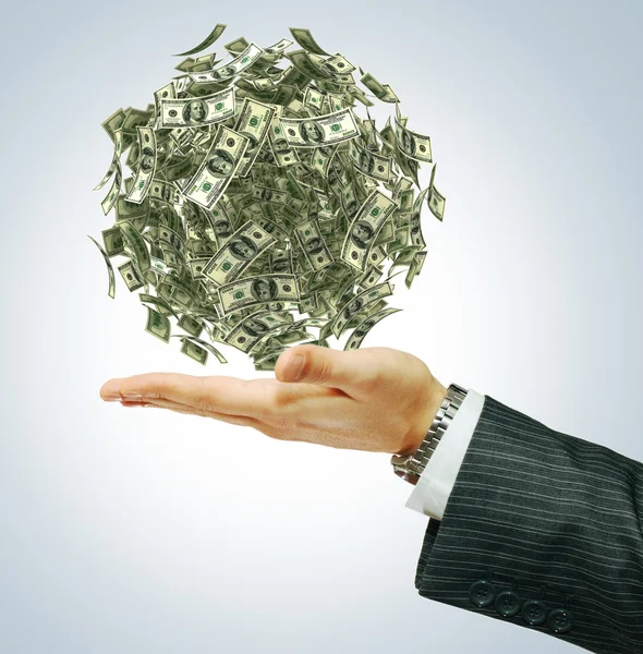 Money on a businessman's hand — Stock Photo, Image