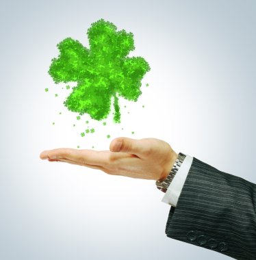 St. Paricks day symbol on businessman hend clipart