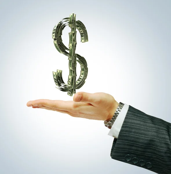Dollar sign on the businessman hand — Stock Photo, Image