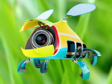 Security flay mini camera over green grass background clipart