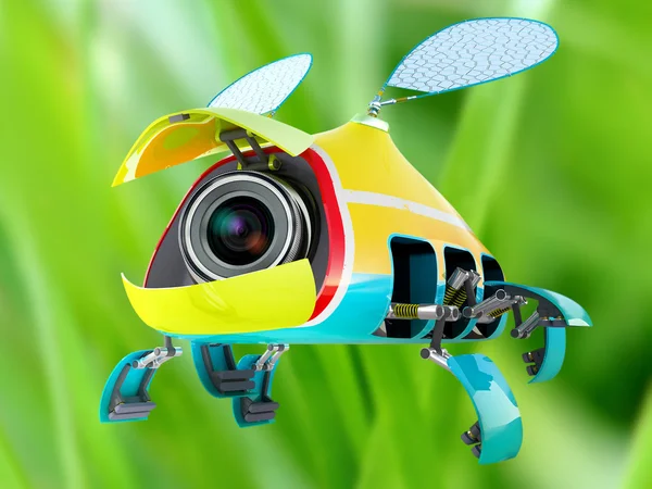 stock image Security flay mini camera over green grass background