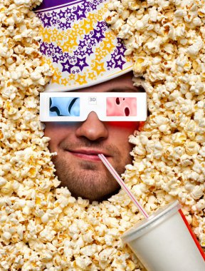 Face in popcorn watching 3D movie clipart