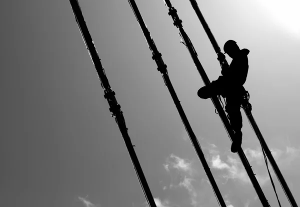 Silhouette of construction climber — Stock Photo, Image