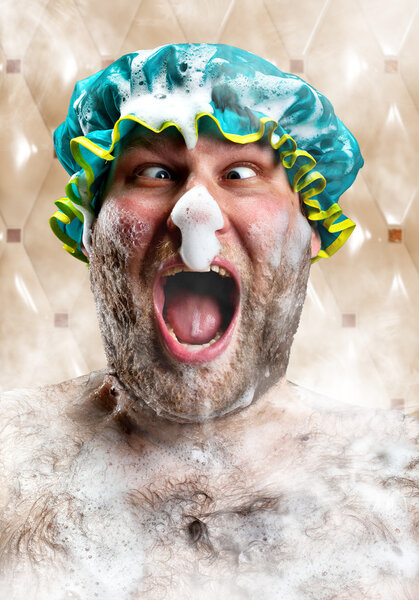 Bizarre man with soap foam on nose