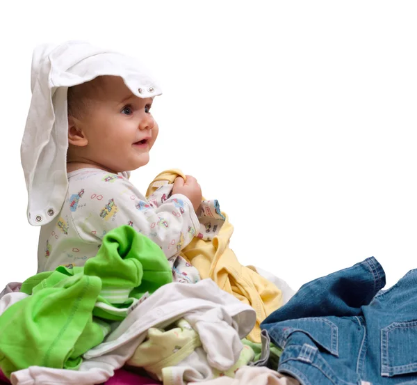 Baby in heap of wear — Stock Photo, Image